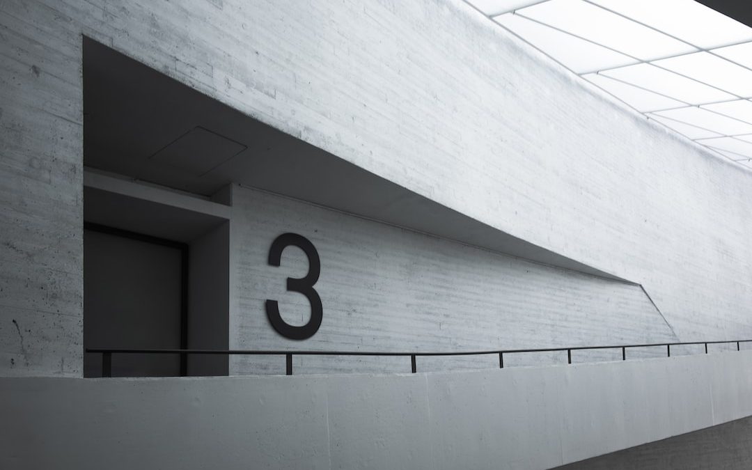 the number three on the wall of a building