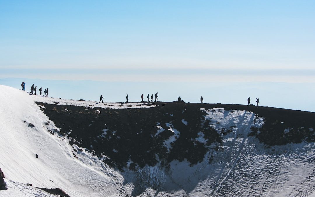 a group of people on a snowy hill
