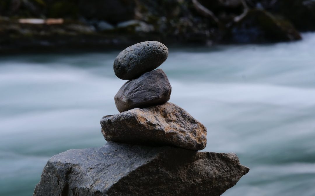 a group of rocks on a rock in the water