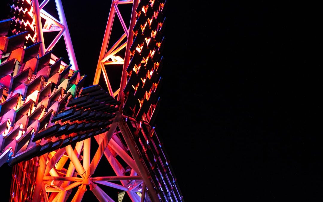 a close up of a very tall structure with lights on it