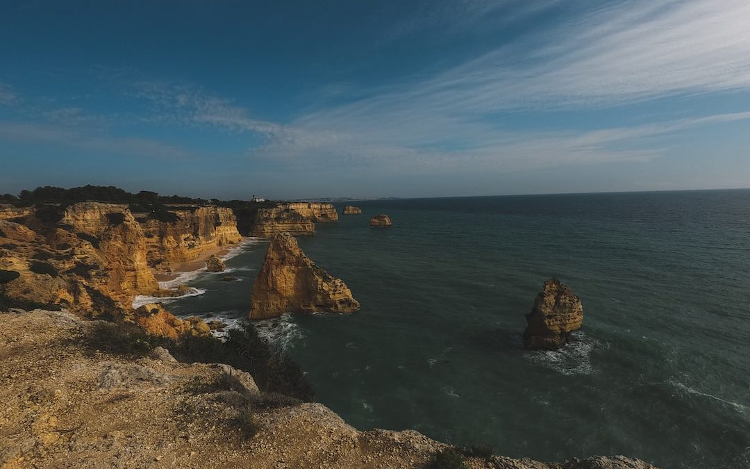 a view of the ocean from the top of a cliff