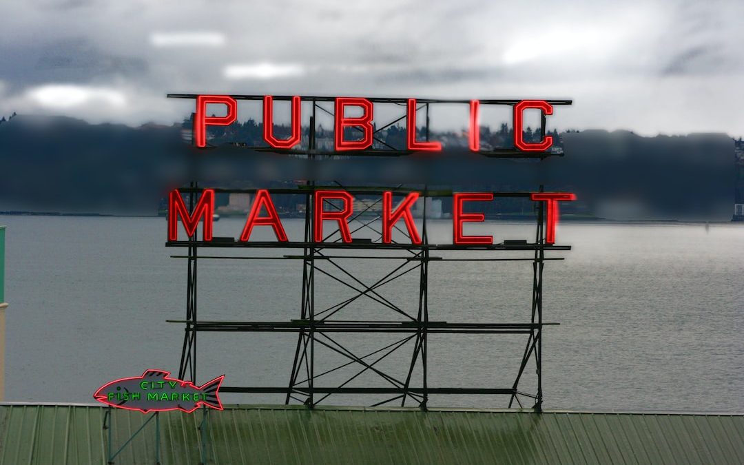 a sign that reads public market on a cloudy day