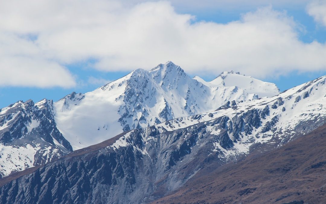 snow covered mountain under blue sky during daytime