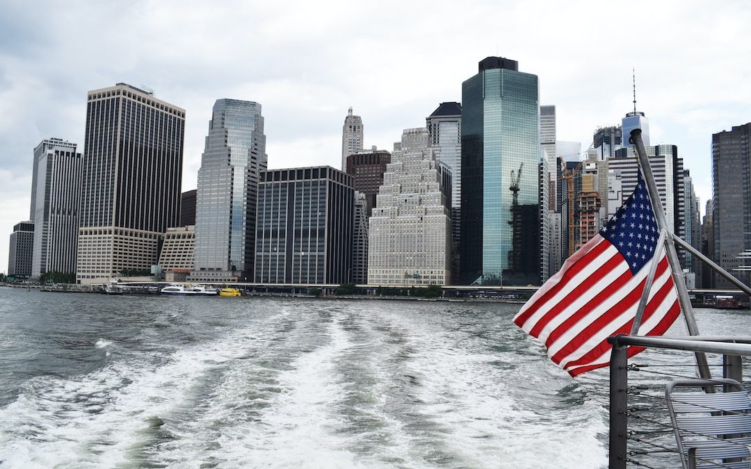 U.S.A. flag on boat near city